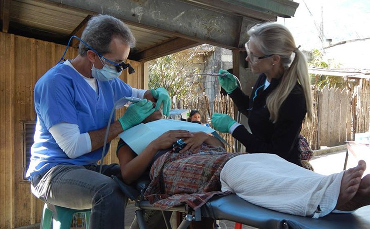 Dentist treating patient at mission