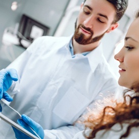 Dentist in Mesquite explaining treatment to a patient