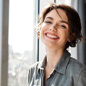 Woman smiling inside her home