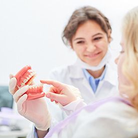 Mesquite dentist showing patient dentures in Mesquite