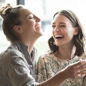 Two women smiling together