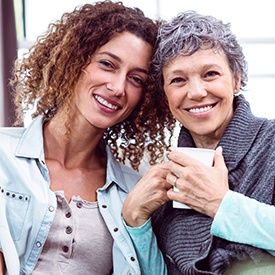 Two women smiling happily