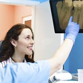 Woman looking at tooth x-rays