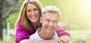 Man and woman smiling together outdoors