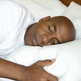 Man sleeping soundly in bed