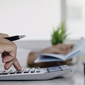 Man calculating cost of teeth whitening in Mesquite