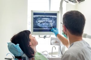 dentist showing patient an X-ray