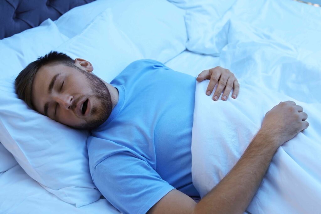 Man sleeping in a bed